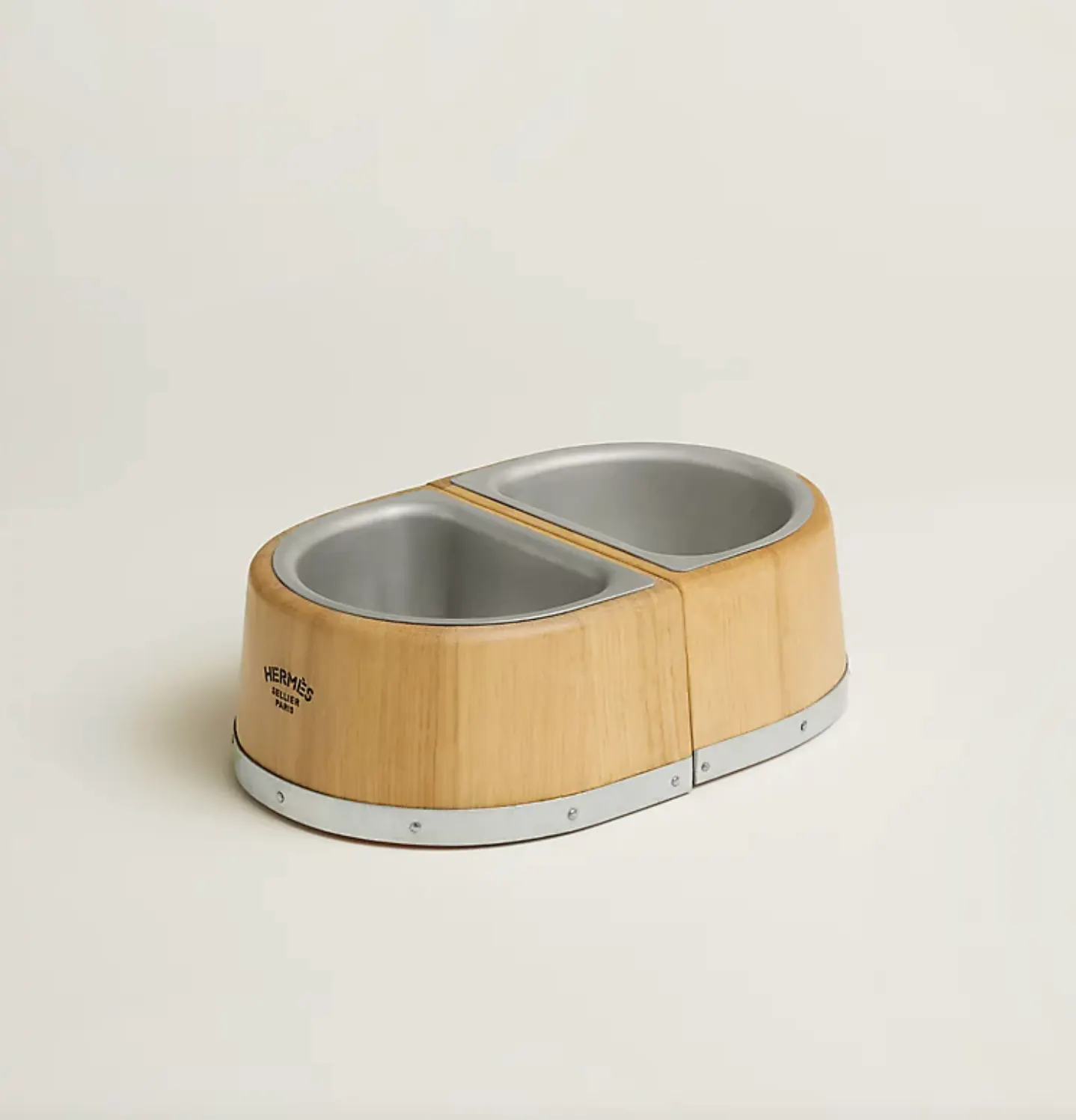 Oak dog bowl inspired by the iconic Chaîne d'Ancre motif and crafted using traditional cooperage techniques.