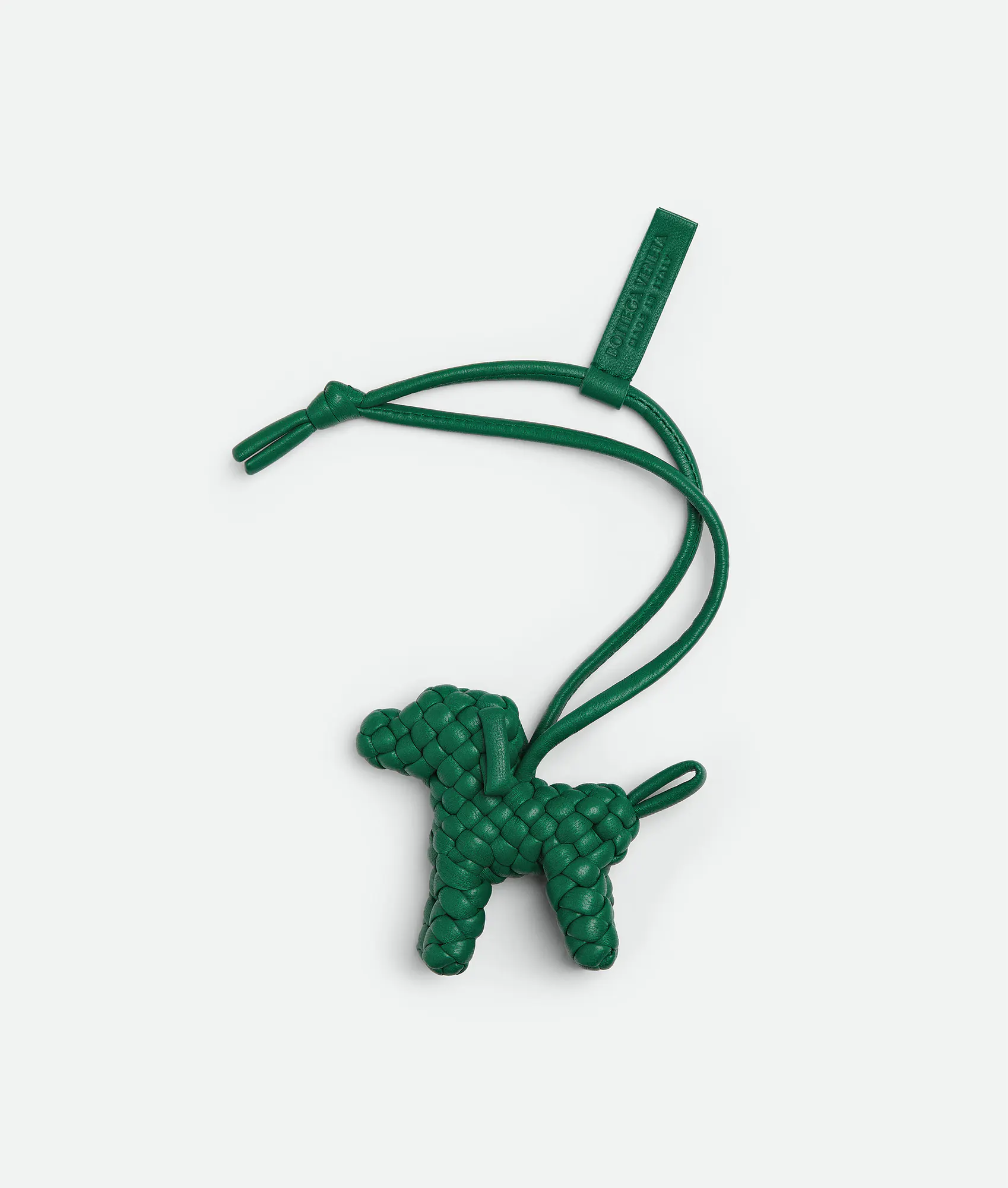 Charm made from Intreccio nappa leather with a dog shape, featuring a leather lanyard.